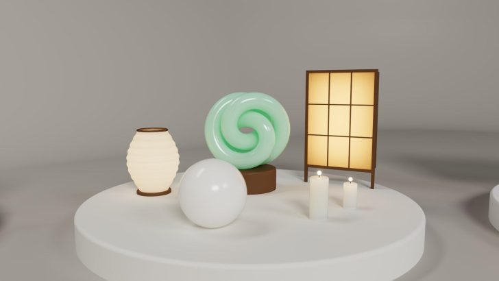 A 3D render shows a glowing green spiral object, a ribbed lantern, a white sphere, two candles, and a lit paper screen panel on a round platform.